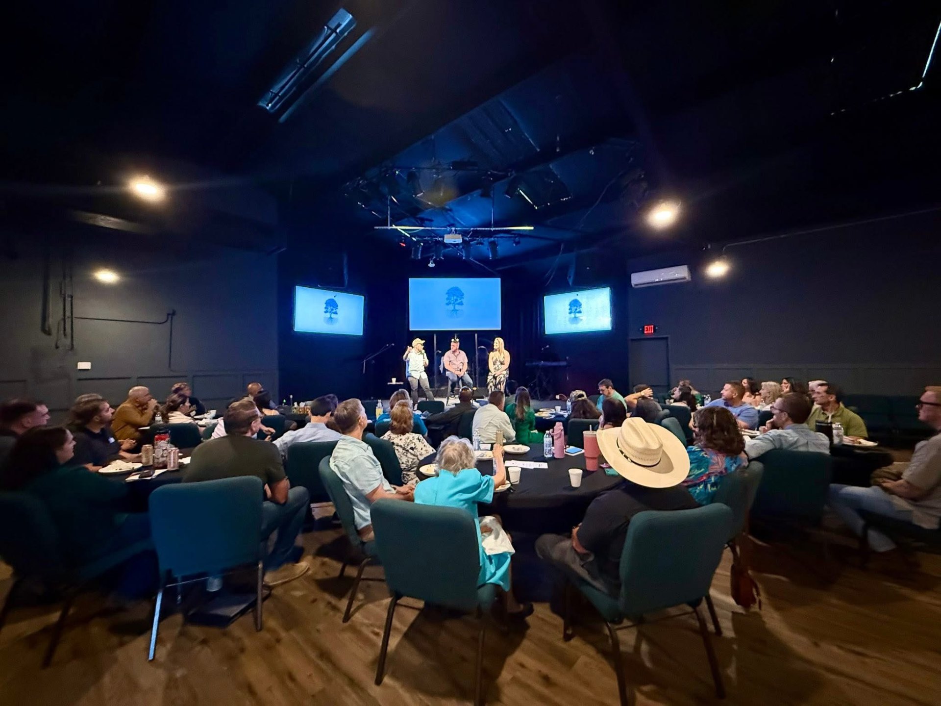 A Table Network gathering in Austin — leaders around dinner tables